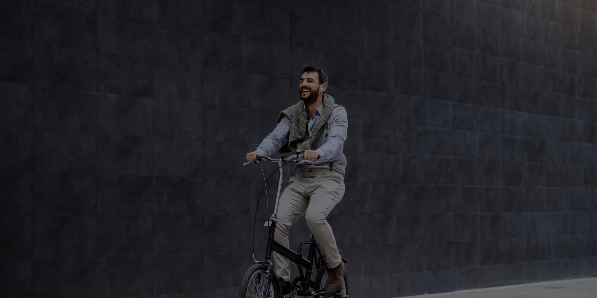 Man riding bike with smile on his face