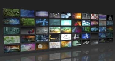 A collage of digital images is displayed in a grid, showcasing various themes like technology, nature, and abstract patterns on a dark background.
