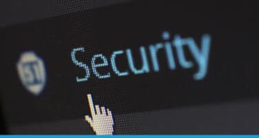 Close-up of a computer screen showing the word "Security" with a cursor hovering over it, symbolizing digital security.